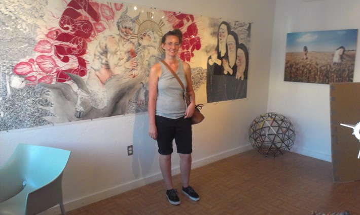 Helen Bayly in front of her large-scale work on paper at Aqua Art Miami, 2012